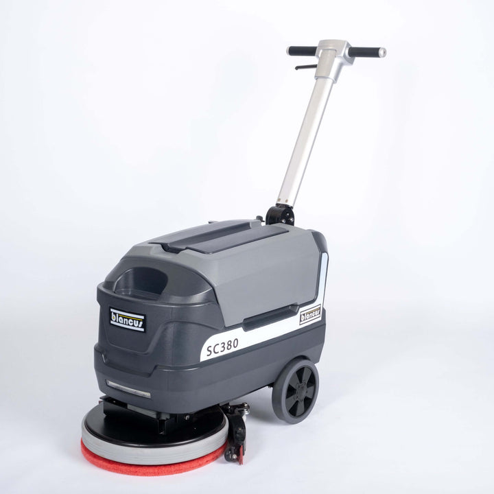 Front side view of grey scrubber dryer walk behind by brand Blancus, model Blancus SC380E.