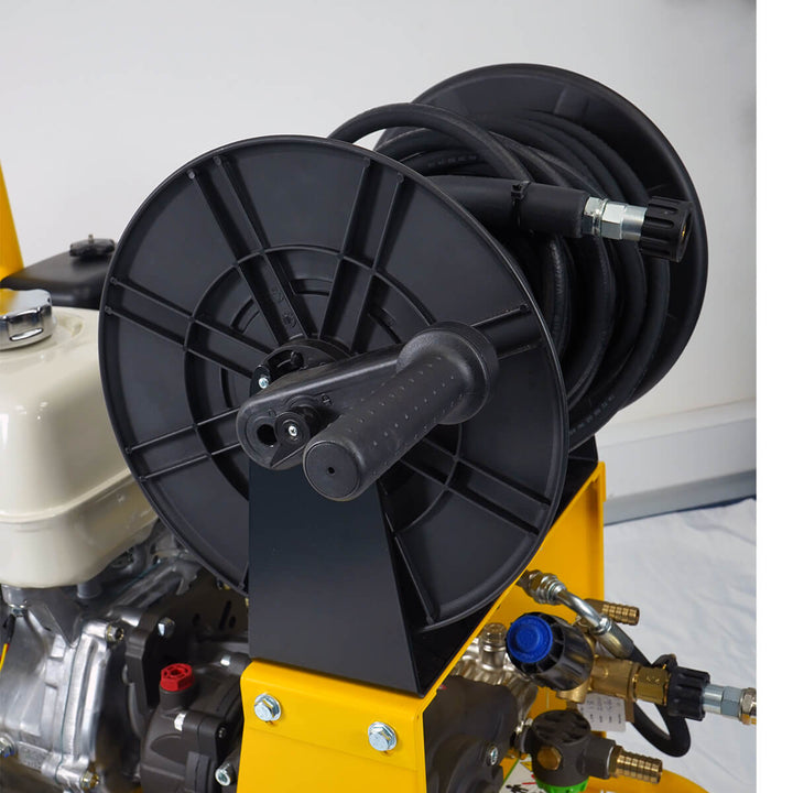 Front side view of yellow and black pressure washer with hose by brand SkyVac, model SlipStream Pro 21X, engine brand Honda.