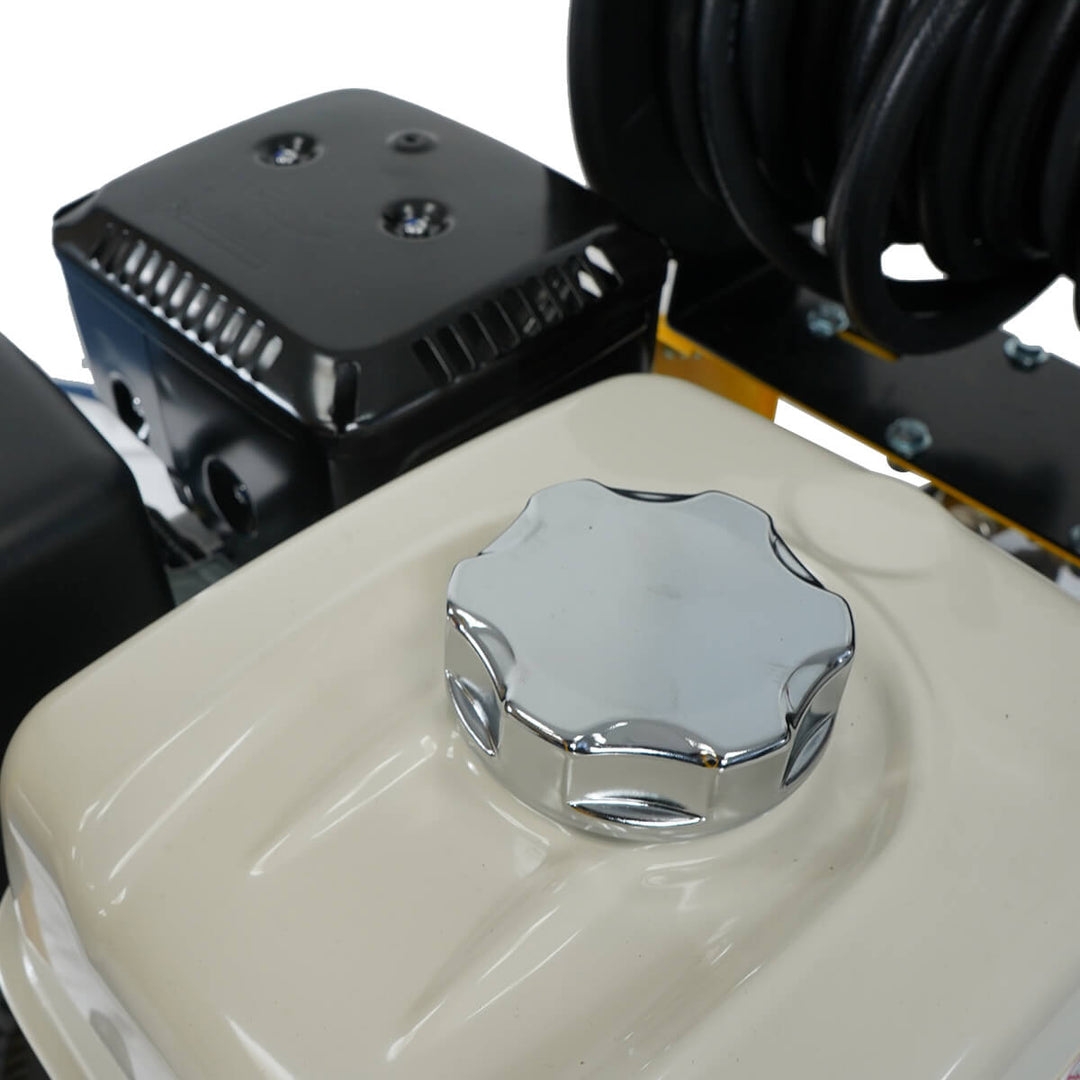 Close up of fuel tank belonging to yellow and black pressure washer by brand SkyVac, model SlipStream Pro 21X, engine brand Honda. 