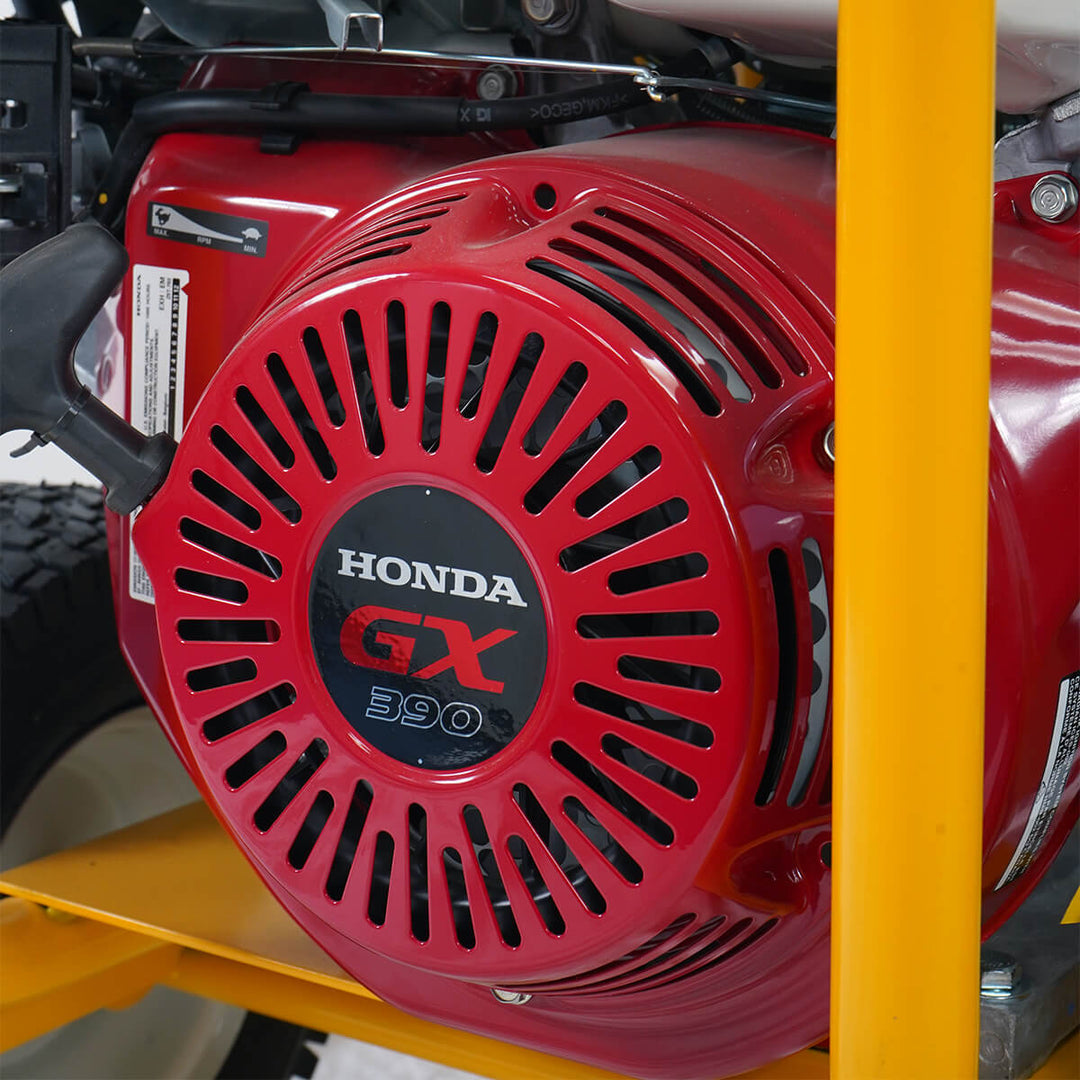 Close up of Honda engine belonging to a yellow and black pressure washer with hose reel by brand Skyvac, model SlimStream Pro 20.