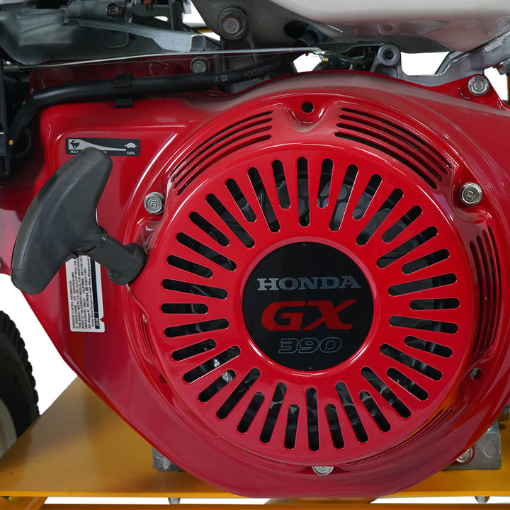 Honda engine belonging to a yellow and black pressure washer with hose by brand SkyVacm model SlipStream.