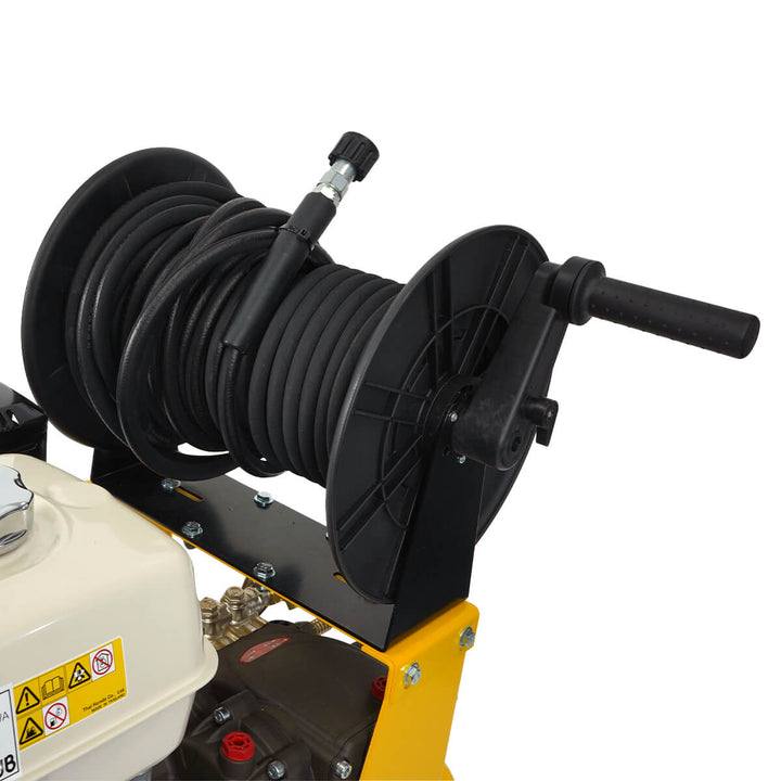 Close up of black hose reel belonging to yellow and black pressure washer by brand SkyVacm model SlipStream, and engine Honda.
