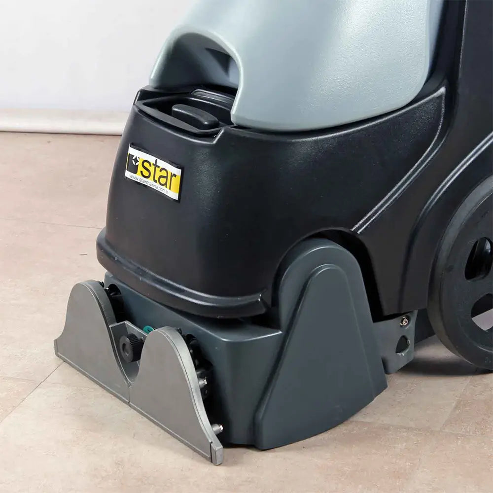 Close up view of sweeper to grey carpet cleaner machine by brand Star, model Combi Compact.
