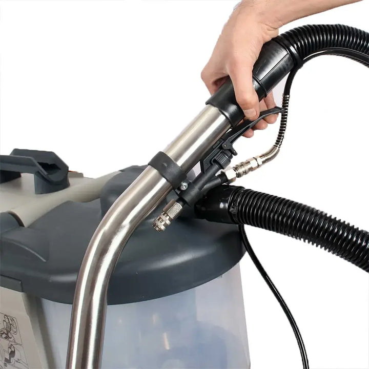 Pipe and hose close up to grey carpet cleaner and sofa cleaning machine by brand Star, model Combo 10/1.