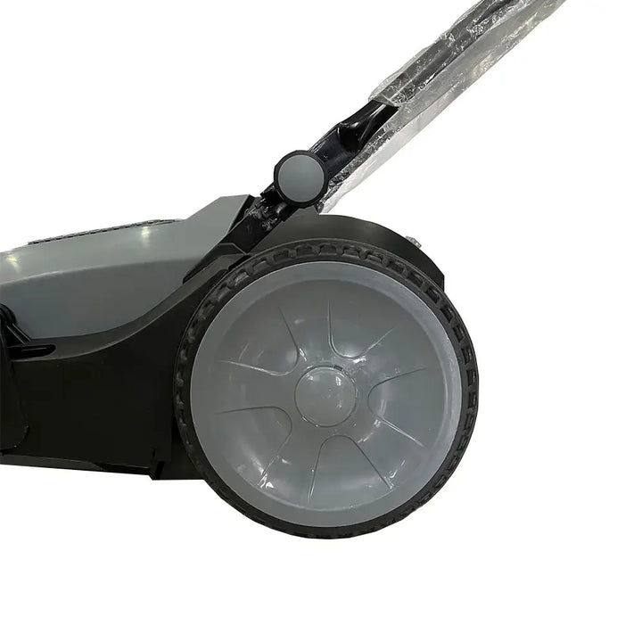 Left side close up view of wheel to grey and black floor sweeper by brand Star, model 92-40.